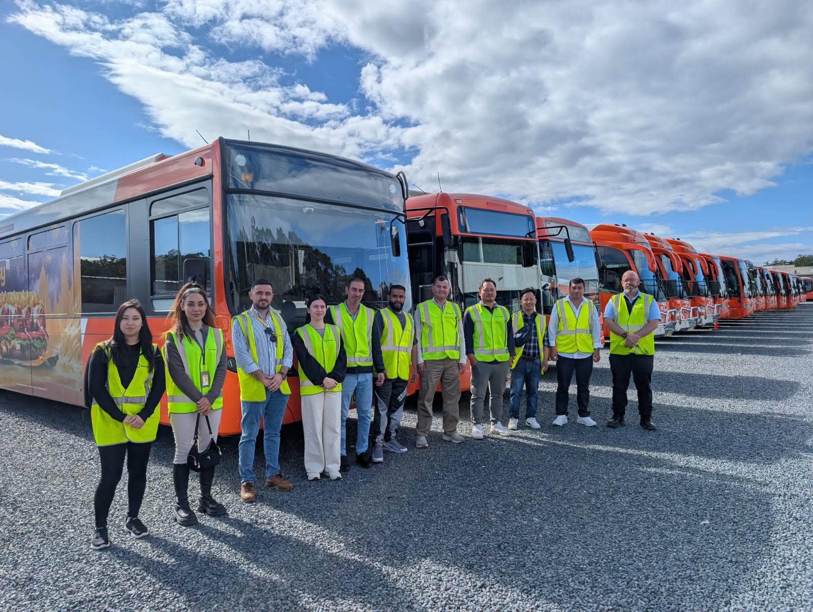 SSI visitor group outside bus depot